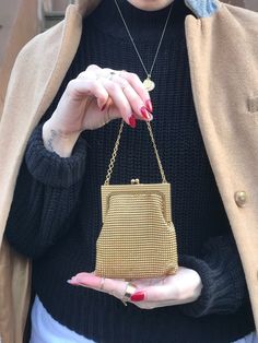 Vintage Whiting and Davis Gold Mesh Coin Purse  Fully lined with gold yellow lining  Mini frame bag with chain handle.  Kiss lock closure  Label: Whiting and Davis Made in USA  Great vintage condition  Approximate measurements  Height: 4" Height (including frame): 4.25"  Length of frame: 3.25"  Length: 4"  Width: 3/8"  Handle drop: 3" Classic Party Bag With Chain Detail, Classic Party Bag With Chain, Classic Gold Bag With Chain Detail, Gold Bags With Gold Chain In Classic Style, Retro Gold Bags With Gold-tone Hardware, Gold Retro Bags With Gold-tone Hardware, Classic Gold Clutch With Gold-tone Hardware, Retro Gold Rectangular Evening Bag, Gold Retro Bags