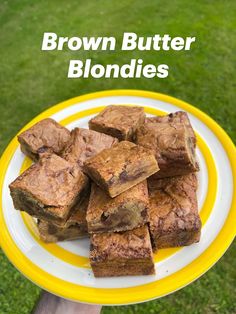 brown butter blondies on a yellow and white plate with the words brown butter blondies