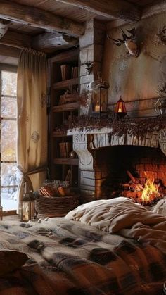 a bedroom with a fire place in the fireplace and lots of blankets on the bed