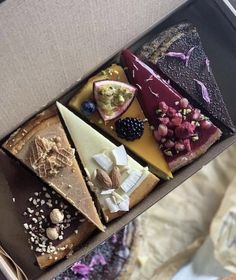 a box filled with different types of desserts