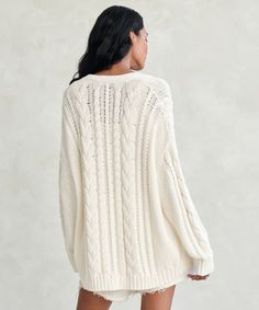 Cable Cardigan Ivory With a luxuriously slouchy fit you’ll want to live in, this lightweight chunky knit is the perfect coastal-inspired addition to any wardrobe. Pack it for a cozy post-beach layer or pair it with a slip dress for an effortless night out. 100% cotton. Made in China. Oversized cable knit sweater with an airy silhouette. Oversized Cable Knit Sweater, Cable Cardigan, Cocoon Cardigan, Jenni Kayne, Cable Knit Sweater, Womens Cardigan, Chunky Knit, Oversized Fits, Cardigan Sweater