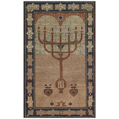 a rug with a menorah on the front and two candles in the middle