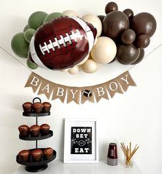 Welcome your little MVP with this adorable baby shower party kit! Featuring muted neutral tones, this balloon garland and Baby Boy football banner is perfect for creating a sweet and memorable celebration. YOU WILL RECEIVE 1 - Football Balloons, 18 inches An Assortment of Quality Latex Balloons 11 inches and 5 inches 3 ft Balloon Strip Balloon Glue Dots Balloon Garland Instructions Fishing Line One burlap football flags with the words Baby Boy in white letters. Strings & A Needle for banner assembly Add more football balloons  at the link below. https://swankypartybox.etsy.com/listing/1791474773 IMPORTANT INFORMATION ASSEMBLY REQUIRED - Your balloons will arrive deflated and ready for blowing and assembly. Your burlap flags will arrive pre-painted & hole punched. Check out our assembly vid Sports Themed Baby Shower Ideas For Boys, Baby Boy Shower Ideas Themes Fall, Nike Baby Shower Theme, Mens Baby Shower