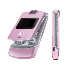 a pink motorola cell phone next to a pen