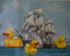 three rubber ducks in front of a sailing ship