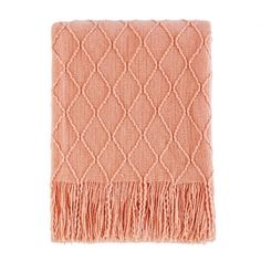 an orange blanket with fringes on the bottom and one pink blanket in the middle