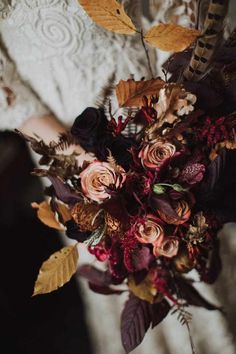 a bride holding a bouquet of flowers in her hands