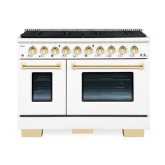 a white and gold stove with two ovens