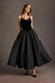 Our Pandora Dropped Waist Maxi Dress will ensure you are on the best-dressed list at your next function. This stunning velvet satin style features a dropped waist design and a voluminous pleated maxi skirt. The perfect style for your next special occasion or an upscale event. Black Tie Inspo Women, Formal 60s Dress, 90s Theme Prom Dress, Wedding Guest Dresses Modest, Drop Waist Dress Formal, Old Hollywood Black Dress, Black Tie Winter Wedding Guest Dress, Drop Waist Prom Dress, Christmas Ball Dresses