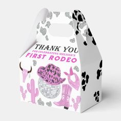 a white box with pink and black designs on the front that says, thank you first rodeo