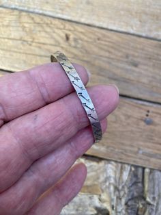 Arrow bangle bracelet...5mm wide, handmade in sterling silver 925....the bracelet is 2 3/8" in diameter, which is between a small and medium braceletgreat looking with an American Indian look. S - 2 1/4 inches (57mm) M - 2 1/2 inches (64mm) L - 2 3/4 inches (70 mm) Sterling Silver Etched Bangle Bracelet, Etched Sterling Silver Bangle, Hand Forged Sterling Silver Bangle Bracelet, Etched Sterling Silver Bangle Bracelet, Stamped Sterling Silver Bangle Bracelet, Stamped Sterling Silver Bangle Cuff Bracelet, Stamped Sterling Silver Bangle, Unique Nickel-free Sterling Silver Bangle, Sterling Silver Etched Cuff Bracelet