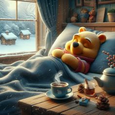 a teddy bear sitting on top of a bed next to a cup of coffee and tea