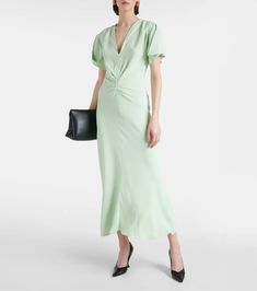 Gathered midi dress in green - Victoria Beckham | Mytheresa Elegant Rayon Maxi Dress For Daywear, Summer Silk V-neck Dress For Work, Elegant Rayon Midi Dress For Work, Summer V-neck Silk Dress For Work, Chic Silk Maxi Dress With Ruched Detail, Spring Silk Midi Dress Knee-length, Casual Evening Maxi Dress In Viscose, Spring Knee-length Silk Midi Dress, Casual Viscose Maxi Dress For Evening