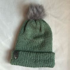 Brand New, Never Worn, Handmade Winter Beanie With Pom-Pom. The Brim Can Be Folded Down For A More Slouchy Look. This Hat Is A Pretty Green Color And Made With A Very Soft Acrylic Yarn. Hat Is Machine Washable, Lay Flat To Dry. The Pom-Pom Can Be Fluffed Up Again With A Hairdryer! Green Cotton Hat For Winter, Green Cotton Winter Hat, Green Winter Hat For Everyday Use, Everyday Green Winter Hat, Green Cozy Beanie One Size Fits Most, Winter Soft Knit Green Hat, Green Soft Knit Winter Hat, Winter Green Soft Knit Hat, Green Knitted Winter Hat