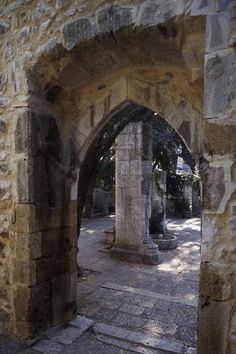 an archway leading into a stone building