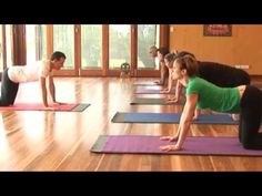 a group of people doing yoga on mats