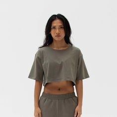 The Easy Crop Top is a must-have essential in your wardrobe. You will love our lightweight organic cotton crop top, which is perfect for your everyday basics. This piece is such a staple throw on our matching comfy sweats for a flawless street look or pair it with your favourite leggings or jeans. Ideal for in the gym and out on the streets. Made from our lightweight organic cotton. 95% organic cotton, 5% Elastane. Dyed with certified Eco-Friendly dyes. GOTS & OEKO-TEX® approved. All packaging i Basic Cropped T-shirt For Loungewear, Cotton Short Sleeve Activewear For Loungewear, Trendy Relaxed Fit Workout Crop Top, Cropped Cotton Workout T-shirt, Cropped T-shirt With Relaxed Fit For Workout, Sporty Everyday Crop Top, Cotton Workout Crop Top, Cotton Athleisure Cropped T-shirt For Workout, Sporty Cropped Shirt With Relaxed Fit For Spring