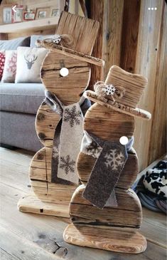 a wooden snowman made out of wood planks