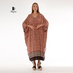 Introducing our stunning Brown Bat Wing Maxi Dress, a true statement piece for your wardrobe! This elegant long sleeve long dress is perfect for any occasion, whether you're dressing up for a special event or simply looking to add a touch of glamour to your everyday style. The unique bat wing design adds a fun and playful twist to this classic silhouette, making it a must-have piece for any fashion-forward individual. Elevate your look with this effortlessly chic and versatile dress that will tu Flowy Long Sleeve Dresses For Beach Cover-up, Brown Long Maxi Dress For Beach Cover-up, Long Sleeve Brown Boho Dress For The Beach, Brown Long Sleeve Boho Dress For The Beach, Long Sleeve Brown Bohemian Boho Dress, Elegant Long Sleeve Dress For Beach Cover-up, Long Sleeve Maxi Dress For Vacation, Flowy Long Sleeve Beach Cover-up Dress, Long Sleeve Flowy Boho Dress For Beach