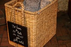 a wicker basket with yarn in it and a sign that says, you can't do anything right now