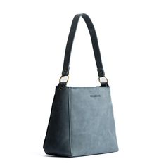 Effortless, Practical, Refined: our Triangle Shoulder Bag is perfect for everyday use. This handbag features a spacious interior and exterior pocket, comfortable shoulder strap and handy zipper.  Add an adjustable crossbody strap for a hands free option. Portland Leather Goods, Triangle Bag, Black Dahlia, Purse Organizer, Canvas Purse, Leather Stand, Purse Organization, Triple Threat, Almost Perfect