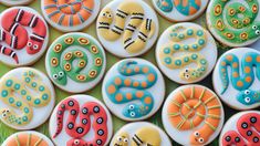 many decorated cookies with different designs on them