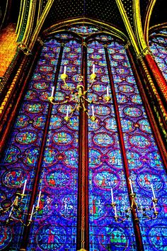 an ornate stained glass window in a cathedral