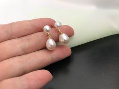 The gorgeous Classic double Pearl earrings are Real Freshwater Cultured White Pearls, and Excellent High Luster .  Great Gift For Bride, Bridesmaid, wedding guests on wedding party, Christmas Day, Birthday, Anniversaries. Etc Size per Pearl: 5-5.5mm, and 8-9mm Pearl Colour: white Pearl Shape: button and Rice shape pearl Pearl Grade: AAAA Pearl Body: 99% clean Pearl Luster: Very High  Ear Post: gold vermeil ( gold color)  or sterling silver ear post ( silver colour) Elegant Gold-plated Pearl Earrings For Anniversary, Formal Silver Gold-plated Pearl Earrings, Teardrop 14k Gold-filled Pearl Earrings For Anniversary, Simple Bridesmaid Jewelry, White 14k Gold-filled Pearl Earrings For Wedding, Double Pearl Earrings, Elegant 14k Gold-filled Pearl White Pearl Earrings, Earring Bridal, Earrings Double