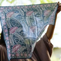 The intricate pattern on our hand-dyed Batik Bandana is crafted by skilled artisans in Indonesia using a 700-year-old batik technique. This bandana is made from white cotton fabric that is then hand-stamped and hand-dyed using 700 years old batik wax and dye technique. The batik fabric is also then sun baked. You should expect some variation of the color. This pattern is called Pakis Pucuk, which translates to Fern Fantasy, in Pink and Blue color. Size: approximately 20”x20”. Due to the pre-wash Indigo Cotton Dupatta With Block Print, Blue Cotton Dupatta With Batik Print, Bohemian Indigo Cotton Dupatta, Bohemian Indigo Batik Print Dupatta, Bohemian Indigo Dupatta With Batik Print, Traditional Hand Printed Cotton Dupatta, Bohemian Cotton Dupatta With Batik Print, Bohemian Cotton Dupatta With Hand Print, Bohemian Cotton Dupatta Hand Printed