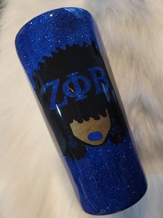 a blue glittered water bottle with the word 70r on it