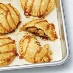 there are some pies that have been cut in half and drizzled with caramel