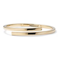 This 14-karat yellow gold bypass bangle bracelet offers an elegant yet modern look with its sleek wraparound design. Modern Yellow Gold Polished Cuff Bracelet, Modern Yellow Gold Bangle With Polished Finish, Modern Yellow Gold Bangle Cuff Bracelet, Modern Yellow Gold Bangle Bracelets, Formal Bangle Bracelet With A Modern Twist, Formal Bangle With Modern Twist, Modern 14k Yellow Gold Bangle, Formal Yellow Gold Bangle With Modern Twist, Chic Yellow Gold Bangle For Formal Occasions