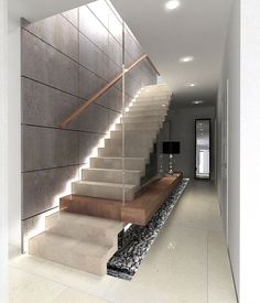 a modern staircase with stone steps leading up to the second floor