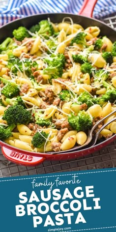 sausage broccoli pasta in a red skillet on a blue and white towel