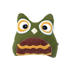 a green stuffed animal with big eyes