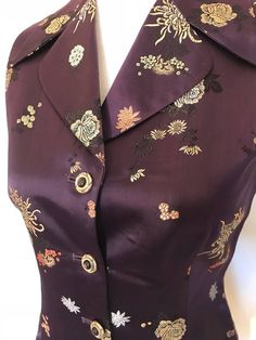 vintage embroidered silk vestV-neck button downBoutique handmadeTailored fittedLinedin pristine conditionsize: S measures shoulder to shoulder: 13”across the chest, arm pit to arm pit: 17”Waist: 29”length: 24”Color: deep eggplant purple, gold, pink, blues, blackComes from smoke/pet free homecondition: excellent vintage Luxury Embroidered Purple Tops, Fitted Vintage V-neck Vest, Elegant Embroidered Sleeveless Vest, Vintage Embroidered Fitted Vest, Fitted Vintage Vest With Embroidery, Vintage Fitted Embroidered Vest, Fitted Vest With Floral Embroidery For Festive Season, Festive Fitted Vest With Floral Embroidery, Formal Silk Vest For Spring