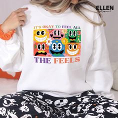 Express yourself with our vibrant "It's Okay to Feel All the Feels" t-shirt. This colorful design features whimsical cartoon faces representing various emotions, reminding us that all feelings are valid. Spread positivity and emotional awareness with this comfortable, eye-catching shirt for all ages. ---------------------------------------------------------------------------- PRODUCT DETAILS & SIZING This unisex tee is made for all-day comfort. It's crafted from super soft, lightweight 100% cotton (solid colors) or a cotton-polyester blend (heathered colors) that feels great against your skin. No itchy side seams or annoying tag thanks to the tear-away label. Plus, the classic crewneck style looks polished enough for those special dad moments, but comfy enough for everyday wear. - Ultra-so Cotton Tops With Multicolor Cartoon Print, Cotton Multicolor Cartoon Print Tops, Cotton Tops With Cartoon Print In Multicolor, Relaxed Fit Multicolor Tops With Cartoon Print, Multicolor Cartoon Print Relaxed Fit Tops, Relaxed Fit Multicolor Cartoon Print Top, Fun Multicolor Tops With Graphic Print, Multicolor Crew Neck Tops With Funny Print, Multicolor Cartoon Print Crew Neck Top