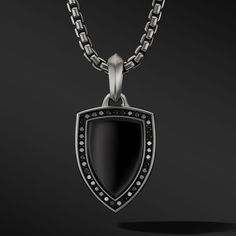 Once linked to spirituality and magic, today’s amulets are expressions of personal style. This collection reflects the modern man’s distinct identities with religious symbols, ancient charms and utilitarian motifs crafted from precious metals and gemstones. Sterling silverBlack onyxPavé black diamonds, 0.33 total carat weightAmulet, 27 x 18mmPlease note: amulet only; chain sold separately Black Sterling Silver Amulet Necklace, Black Oxidized Amulet Jewelry, Black Amulet Jewelry With Oxidized Finish, Luxury Black Oxidized Jewelry, Luxury Black Jewelry With Oxidized Finish, Black Spiritual Jewelry With Oxidized Finish, Spiritual Black Jewelry With Oxidized Finish, Petite Jewelry, Religious Symbols