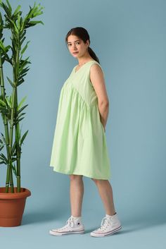 Sleeveless linen dress, Empire waist dress, Summer midi dress, Knee length Linen dress, V neck midi dress, Empire waist midi dress>DESCRIPTION<- loose and roomy- made from Linen blend. The fabric is of medium weight (185 g).- the model is 172 cm high (regular XS - S) and is wearing size S. - color in the picture - TEA GREEN - (Please choose colors from drop down menu).>FIT<- The dress is a bit loose and roomy.>COLOR<- The dress is available in 40 colors.- We found out the fabri Green Cotton Midi-length Sleeveless Dress, Green Cotton Midi Length Sleeveless Dress, Green Cotton Sleeveless Midi Dress, Green Midi-length V-neck Summer Dress, Green Midi V-neck Dress For Summer, Green V-neck Knee-length Dress For Spring, Summer Knee-length Cotton Midi Dress, Summer A-line Midi Dress For Daywear, Spring Mid-length Linen Dress For Daywear