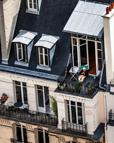 an apartment building with two balconies on the second floor and one balcony area