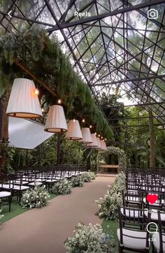 an outdoor wedding venue with chairs and lights