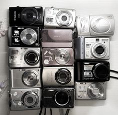 a bunch of cameras sitting on top of each other