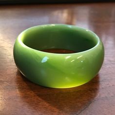 Exceptional Siberian Jade light green Bangle. Unfortunately there is a fracture that goes through half of the bangle (picture with the light coming through the bangle) Measures approximately 53.65 x 24.7 Fantastic deal at this price due to the fracture Jade Charm, Jade Bangle, Jade Earrings, Jade Bracelet, Jade Carving, Jade Jewelry, Jade Beads, Jade Pendant, Drop Pendant