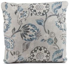 a gray and blue pillow with flowers on it