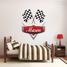 a bedroom with a bed and two racing flags on the wall