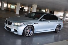 a silver car parked in a parking garage