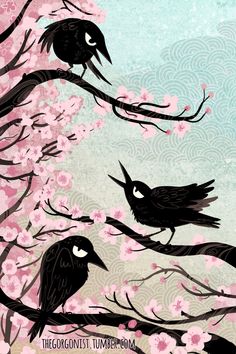 two black birds sitting on top of a tree branch with pink flowers in the background