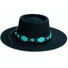 Price includes a Brigitte Sambboho hat & a Saint Barth hatband. Save 10% with this bundle. Select hat size. Hatband is one size fits all. Hatband is removable. The fanciest hat you will ever wear. Sambboho's Brigitte black hat is a dipped crown boater design with a custom trimmed genuine velvet black band. A structured and stiff short-brimmed boater style. Use to make an impression! Dipped crown oval boater hat in Black Trimmed with genuine Velvet Black Band Hat material: 100% soft Brazilian woo Beaded Hats, Beaded Belts, Leather Quiver, Billy Jack, Cowboy Hat Bands, Closet Clothing, Beaded Hat Bands, Native Beading Patterns, Hat Bands