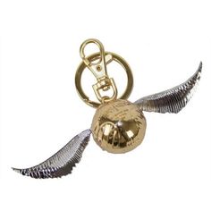 a golden metal keychain with an angel's wing and bell on it