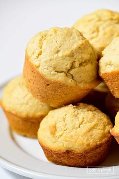 a white plate topped with muffins on top of a table